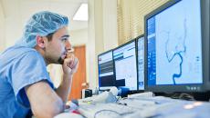 Healthcare worker looking at a display