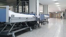 Hospital beds parked in a corridor
