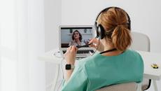 Physician and patient have a telehealth consult