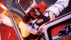 An emergency patient being loaded into an ambulance